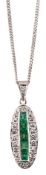 An emerald and diamond pendant