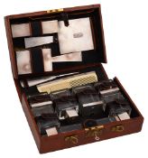 A George V Art Deco pigskin cased silver travelling dressing set