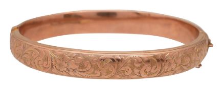 A 9ct gold hinged bangle
