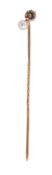 A light cinnamon coloured diamond and cultured pearl stick pin