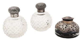 A pair of silver mounted glass scent bottles and an inkwell