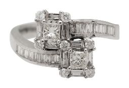 A diamond two stone cross over ring,