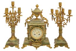 A green onyx and gilt metal three piece clock garniture