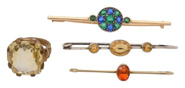 A yellow sapphire ring and three other items