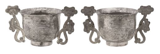 A pair of Chinese export silver twin handled wine cups