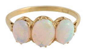 A three stone oval cabochon opal ring