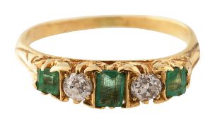 An emerald and diamond five stone ring