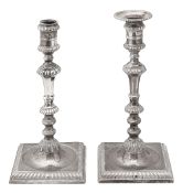 A pair of George II silver candlesticks