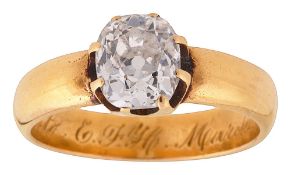 A gold single stone diamond ring
