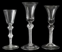 Three mid 18th century air twist wine glasses c.1750