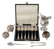 A late 19th century Indian Cutch silver three piece cruet set + other silver