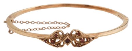 A 1970s 9ct gold and garnet set bangle