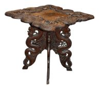 A Kashmiri carved hardwood occasional table.