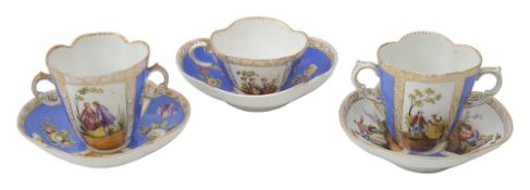 Two Dresden Chocolate Cups and Saucers and a cabinet cup and saucer