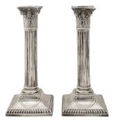 A pair of Victorian silver candlesticks