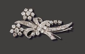 A diamond-set floral spray brooch