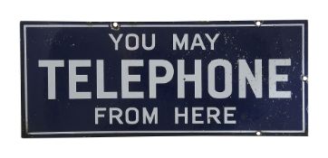 A blue and white enamel telephone sign