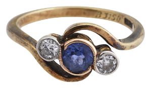 A sapphire and diamond three stone cross-over ring