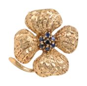 A mid 20th century sapphire-set flowerhead brooch