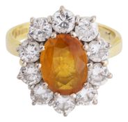 A yellow sapphire and diamond-set cluster ring