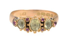 A peridot and yellow gold ring
