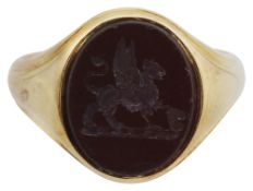 A red hard stone intaglio signet ring