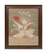 An Arts and Crafts silk embroidered picture of a flower basket
