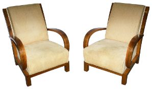 A pair of walnut and upholstered Art Deco armchairs