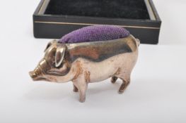 EARLY 20TH CENTURY WHITE METAL PIG PIN CUSHION