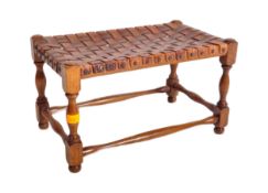 1920'S OAK AND LEATHER STRAP WORK FOOT STOOL SEAT