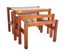 MID 20TH CENTURY SMOKED GLASS TEAK NEST OF TABLES