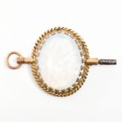 VINTAGE YELLOW METAL & OPALINE GLASS WATCH KEY