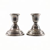 A PAIR OF SILVER HALLMARKED STUB CANDLESTICKS