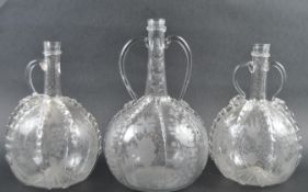 SET OF THREE DUTCH GLASS BULBOUS DECANTERS