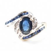 WHITE GOLD SAPPHIRE & DIAMOND CROSSOVER RING