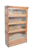 GLOBE WERNICKE - 20TH CENTURY OAK FOUR SECTION BOOKCASE