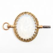 VINTAGE YELLOW METAL & OPALINE GLASS WATCH KEY