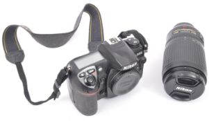 NIKON D200 DIGITAL CAMERA T/W NIKON SWM VR ED IF LENS ZOOM