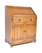 JACOBEAN REVIVAL 20TH CENTURY OAK BUREAU DESK