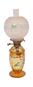 EARLY 20TH CENTURY GLASS ENAMELLED OIL LAMPS