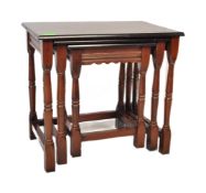 20TH CENTURY JACOBEAN REVIVAL OAK NEST OF GRADUATING TABLES