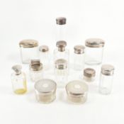 ASSORTED HALLMARKED SILVER LIDDED GLASS BOTTLES