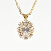 COLLECTION OF GOLD PLATED WHITE STONE PENDANTS