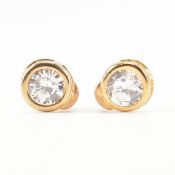 APPROX 30 PAIRS OF WHITE STONE STUD EARRINGS