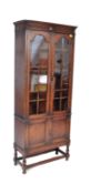 AN ARTS & CRAFTS CIRCA 1930S DISPLAY GLAZED CABINET