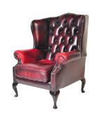 20TH CENTURY OXBLOOD CHESTERFIELD STYLE WINGBACK ARMCHAIR