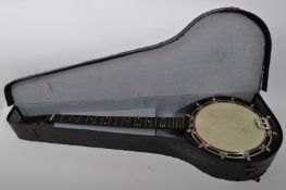 VINTAGE SIX STRINGS BRITISH MAKE BANJO IN CASE