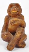 20TH CENTURY COMPOSITE AMBER MONKEY FIGURE