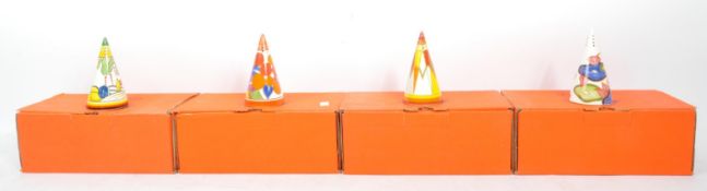 A GROUP OF FOUR CONTEMPORARY CLARICE CLIFF SUGAR CASTERS