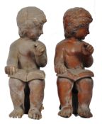 PAIR OF EARLY 20TH CENTURY CARVED PINE WOOD READING CHERUBS